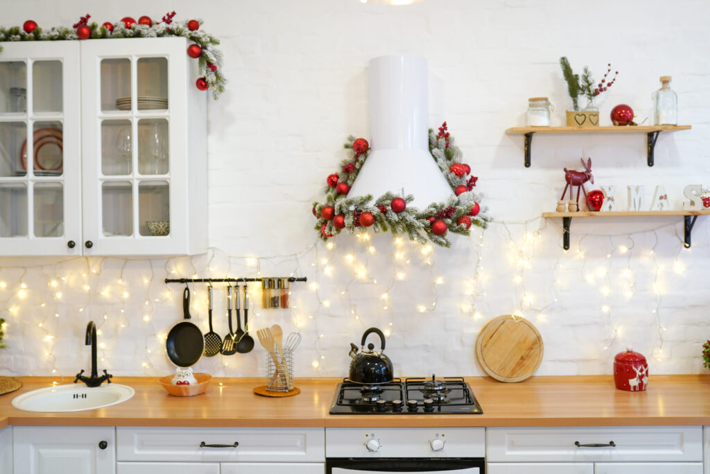 winter kitchen with red decorations, christmas cooking table and utensils
